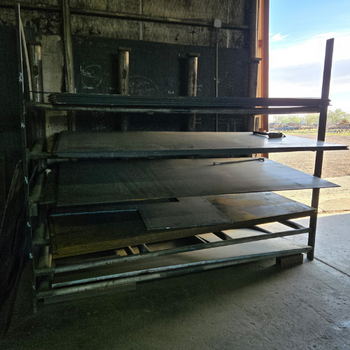 Sheets of steel stacked inside of the United Supply Inc. warehouse.